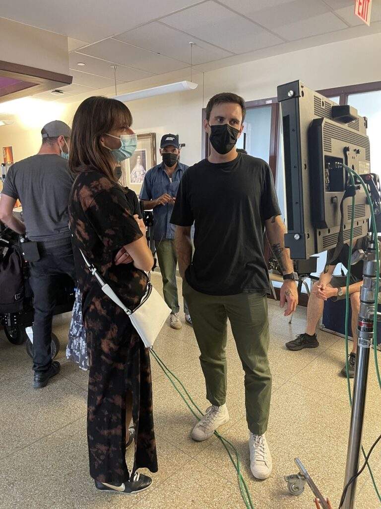 Creative Director Addie Gillespie (left) with Director Lucas Dabrowski (right) reviewing a shot on a hospital set.